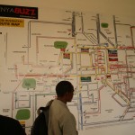 P1010006 Drummond Pike and ACORN Kenya organizers looking at the "matatu" bus map on the iHub wall