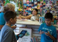 Ruth Fremson/The New York Times Guadalupe Perez, center, took out a loan to expand her party supply store in Jackson Heights, Queens.
