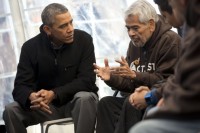 President Barack Obama listens to Eliseo Medina, right, Secretary-Treasurer of Service Employees International Union (SEIU), as he meets with individuals who are taking part in Fast for Families on the National Mall in Washington, Friday, Nov. 29, 2013. (Pablo Martinez Monsivais/ Associated Press)