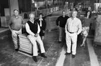 The Vaughan-Bassett team that took on China, from left: J. Doug Bassett IV, John D. Bassett III, Taiwanese translator and consultant Rose Maner, company comptroller Doug Brannock, Wyatt Bassett, and Vice President Sheila Key. Photo by David Hungate for Slate Magazine.