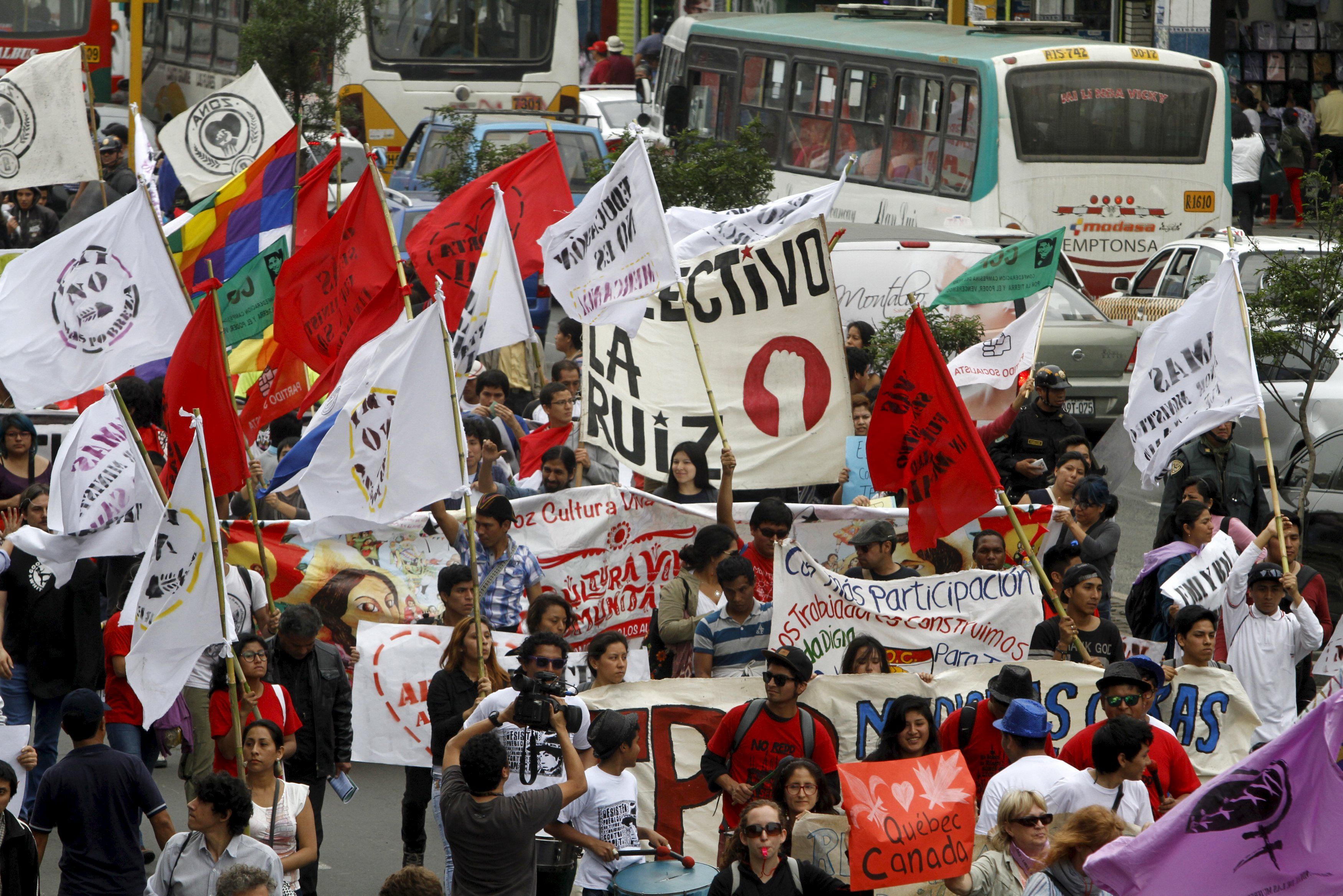 Peruvian workers and activist protest against the 2015 IMF/World Bank Annual Meetings in Lima, Peru, Oct 9, 2015.