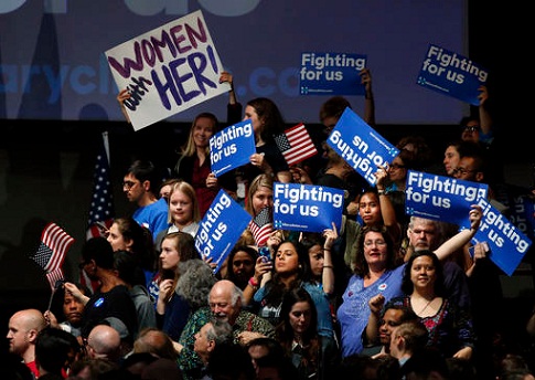 Supporters of Democratic presidential candidate Hillary Clinton cheer at her New York primary campaign headquarters, Tuesday, April 19, 2016, in New York