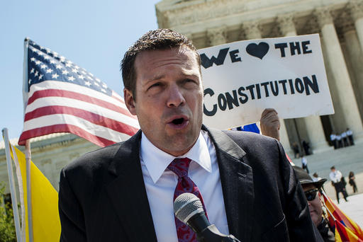 April 25, 2012 - Washington, District of Columbia, U.S. - Kansas Secretary of State KRIS W. KOBACH speaks to the media outside of the Supreme Court on Wednesday after the Court heard arguments on Arizona's controversial immigration law. Kobach played a significant role in the drafting of the law known as Arizona Senate Bill 1070 which seeks to crack down on illegal immigration. (Credit Image: © Pete Marovich/ZUMAPRESS.com)