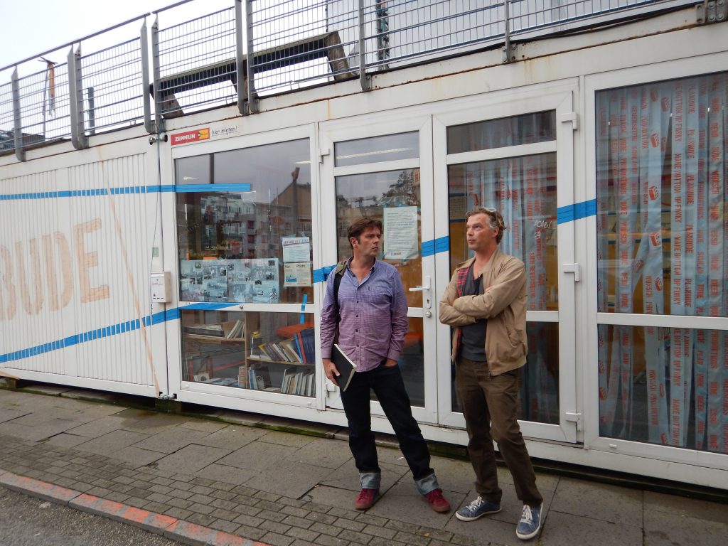 Christoph Schaeffer and Christoph Twickel talking about the community benefit campaign - Plan Buda -- at the Esso Hausen