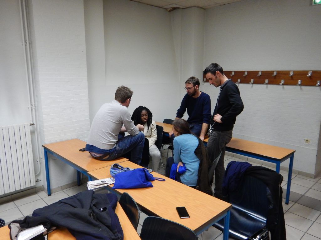 adrien roux of ACORN partner ReAct listens in on a small group at the end of workshop