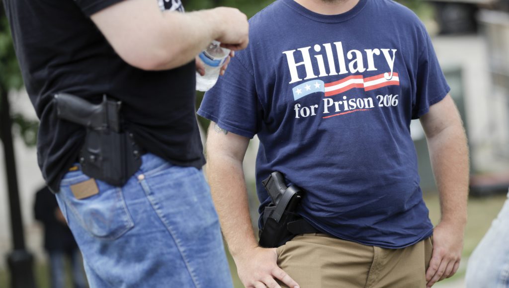 Supporters carrying side arms wait for the start of a rally for Republican presidential candidate Donald Trump (AP Photo/Patrick Semansky)
